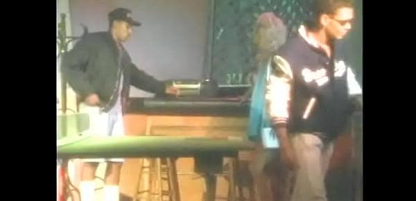  Watch blonde MILF Nine Hartley get on her knees in  bar and suck a black cock